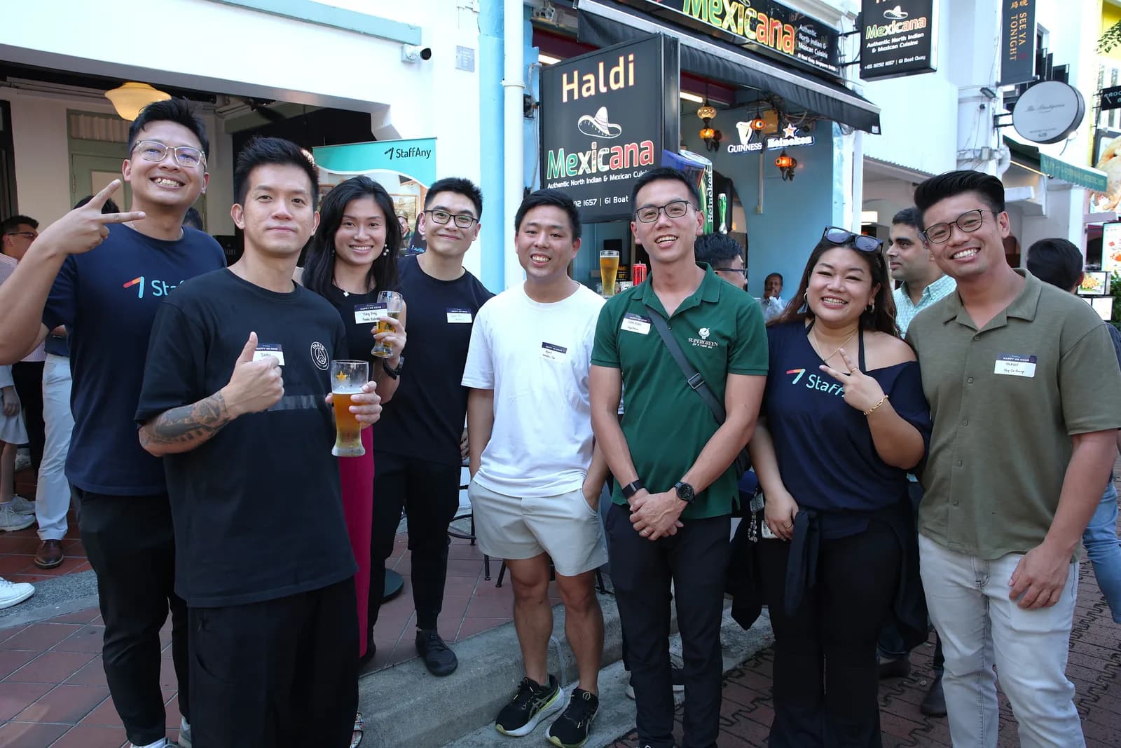 Attendees standing together outside a venue at a StaffAny Singapore community gathering