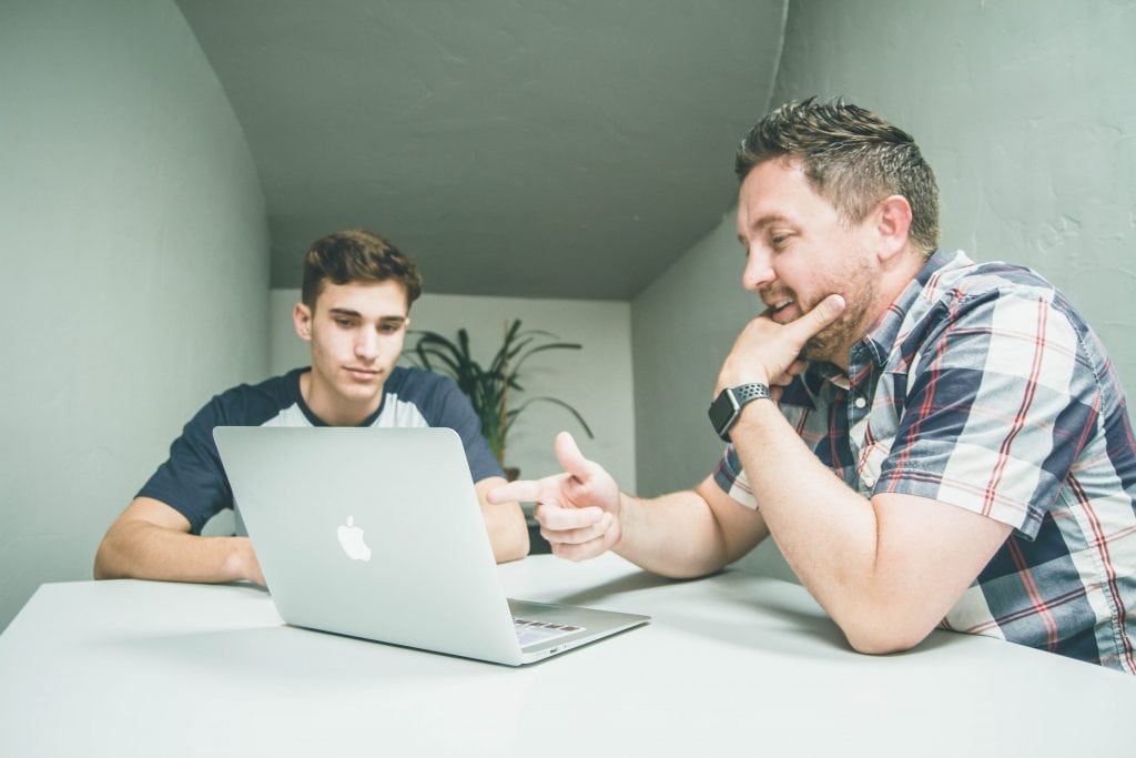 a boss mentors one of his staff members